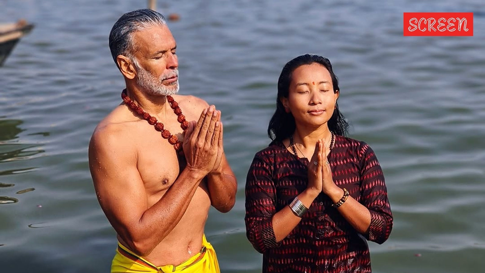 Milind Soman takes holy dip with wife Ankita Konwar at Maha Kumbh Mela ...