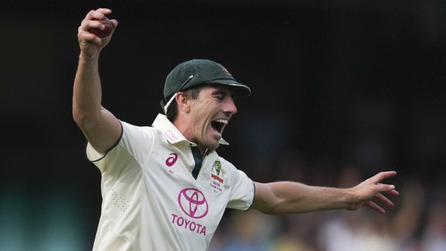 Australia's captain Pat Cummins reacts after taking a catch to dismiss India's Nitish Kumar Reddy during play on the second day of the fifth cricket test between India and Australia at the Sydney Cricket Ground, in Sydney, Australia, Saturday, Jan. 4, 2025. (AP Photo)