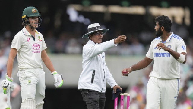 Umpire Sharfuddoula Saikat, centre, gestures to India's Jasprit Bumrah, right, as he exchanges words with Australia's Sam Konstas, left, during play on the first day of the fifth cricket test between India and Australia at the Sydney Cricket Ground, in Sydney, Australia, Friday, Jan. 3, 2025. (AP Photo)