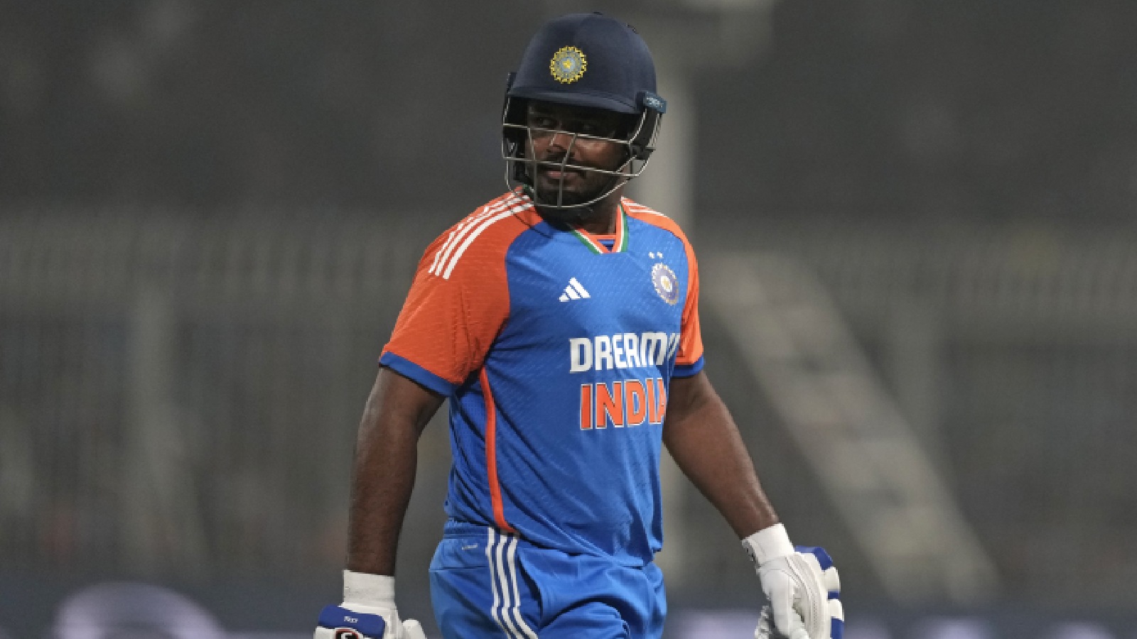 India's Sanju Samson walks off the field after losing his wicket during the first T20 cricket match between India and England at Eden Gardens in Kolkata, India, Wednesday, Jan. 22, 2025. (AP Photo)