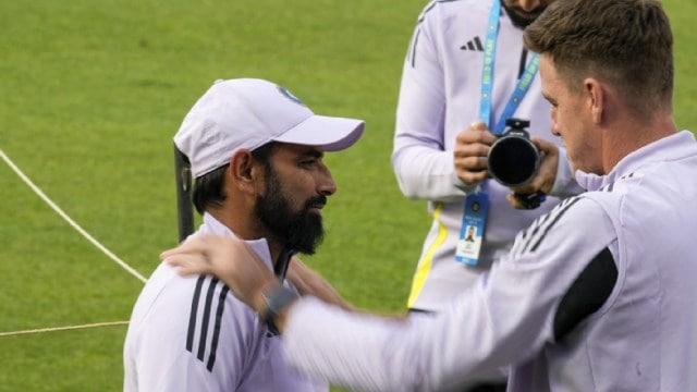 India's Mohammed Shami, near  talks with bowling manager  Morné Morkel during the signifier    league   up  of their archetypal  T20 lucifer  against England, successful  Kolkata, India, Sunday, Jan. 19, 2025. (AP Photo)