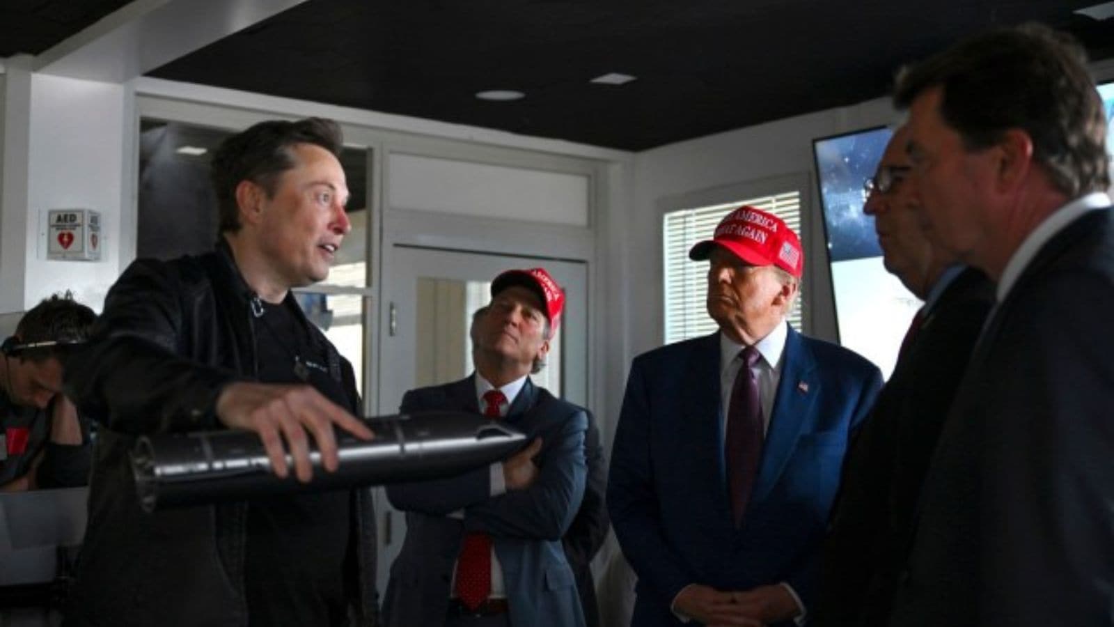 President-elect Donald Trump and lawmakers listen as Elon Musk explains the operations ahead of the launch of the sixth test flight of the SpaceX Starship rocket.