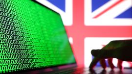 Illustration shows a laptop with binary codes displayed in front of the UK flag in this illustration taken, August 19, 2022. REUTERS/Dado Ruvic/Illustration