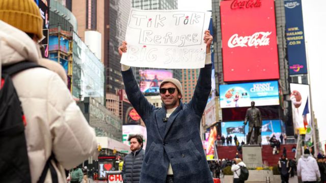 A societal  media influencer films a video for his caller   Xiaohongshu, besides  known arsenic  RedNote, aft  leaving TikTok, successful  Times Square successful  New York City, U.S., January 16, 2025. (REUTERS/Brendan McDermid/File Photo)