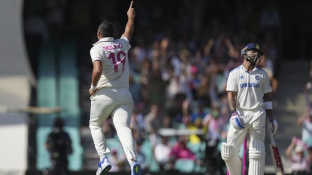 Australia's Scott Boland, left, celebrates after dismissing India's Virat Kohli, right, during play on the second day of the fifth cricket test between India and Australia at the Sydney Cricket Ground, in Sydney, Australia, Saturday, Jan. 4, 2025. (AP Photo)