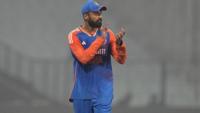 India's Varun Chakravarthy applauds teammates during the archetypal  T20 cricket lucifer  betwixt  India and England astatine  Eden Gardens successful  Kolkata, India, Wednesday, Jan. 22, 2025. (AP Photo