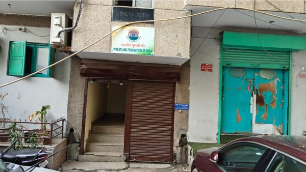 Hari Nagar 1: July, 2024: A WFI nameplate at the entrance to the building in Hari Nagar.  