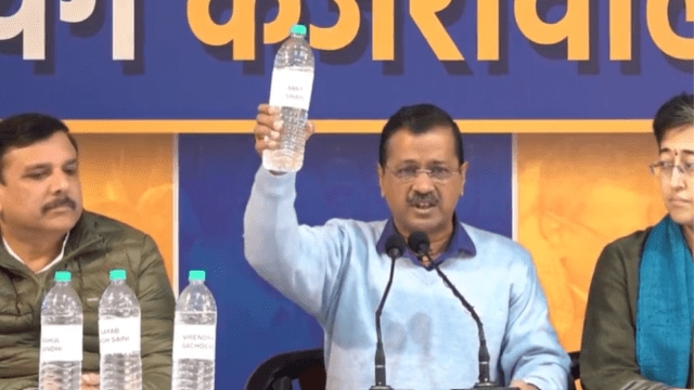 Arvind Kejriwal holds up   vessel  of Yamuna h2o  astatine  a property   league  (PTI)