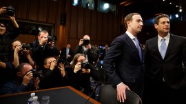 Facebook CEO Mark Zuckerberg arrives to testify at a Senate hearing with Joel Kaplan, Facebook's vice president of global public policy in Washington, April 10, 2018.