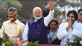 Prime Minister Narendra Modi, flanked by Andhra Pradesh Chief Minister N Chandrababu Naidu and Deputy Chief Minister K Pawan Kalyan in Visakhapatnam on Wednesday. (PTI Photo)