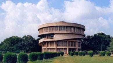 Punjab panjab university building with green trees and blue sky