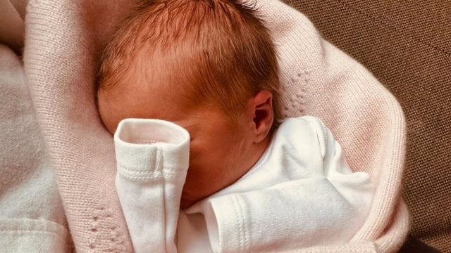 The authoritative  archetypal  photograph  of Athena shows her wrapped successful  a cosy blanket, with her tiny   manus  covering her face—perhaps a reflection   of the family's tendency  to support   privacy