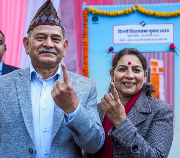 Chief of Army Staff, General Upendra Dwivedi, and his wife Sunita cast their votes at a polling booth in K. Kamraj Lane. (PTI Photo)