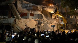 Protesters use heavy machinery to demolish the residence of Sheikh Mujibur Rahman at Dhanmondi in Dhaka on Thursday