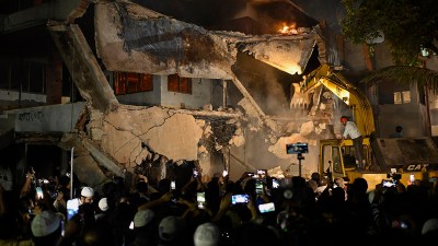 Protesters use heavy machinery to demolish the residence of Sheikh Mujibur Rahman at Dhanmondi in Dhaka on Thursday