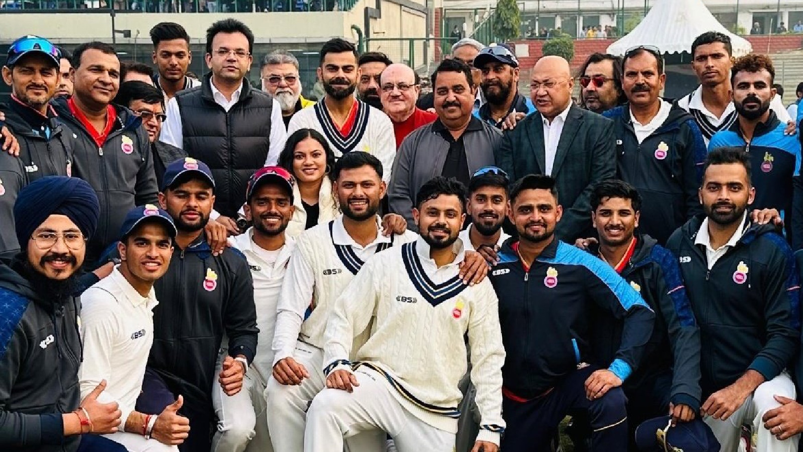 The Delhi Ranji Trophy team, including Virat Kohli, poses for a photo after defeating Railways at the Arun Jaitley Stadium. (Credit: X/@imshivamsharma9)