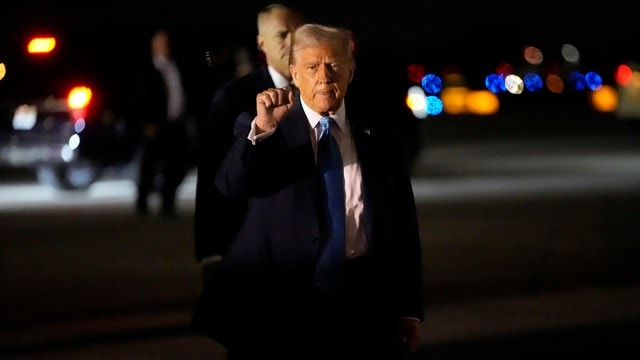  President Donald Trump gestures arsenic  helium  arrives astatine  Palm Beach International Airport connected  Friday.