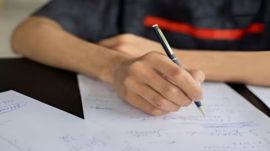 Student writing exam generic image