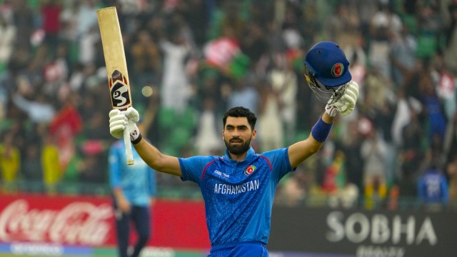 Afghanistan's Ibrahim Zadran celebrates after scoring century during the ICC Champions Trophy cricket match between Afghanistan and England, in Lahore, Pakistan, Wednesday, Feb. 26, 2025. (AP Photo)