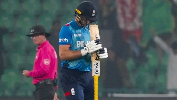 England's Joe Root reacts as he walks off the field after his dismissal during the ICC Champions Trophy cricket match between Afghanistan and England, in Lahore, Pakistan, Wednesday, Feb. 26, 2025. (AP Photo)