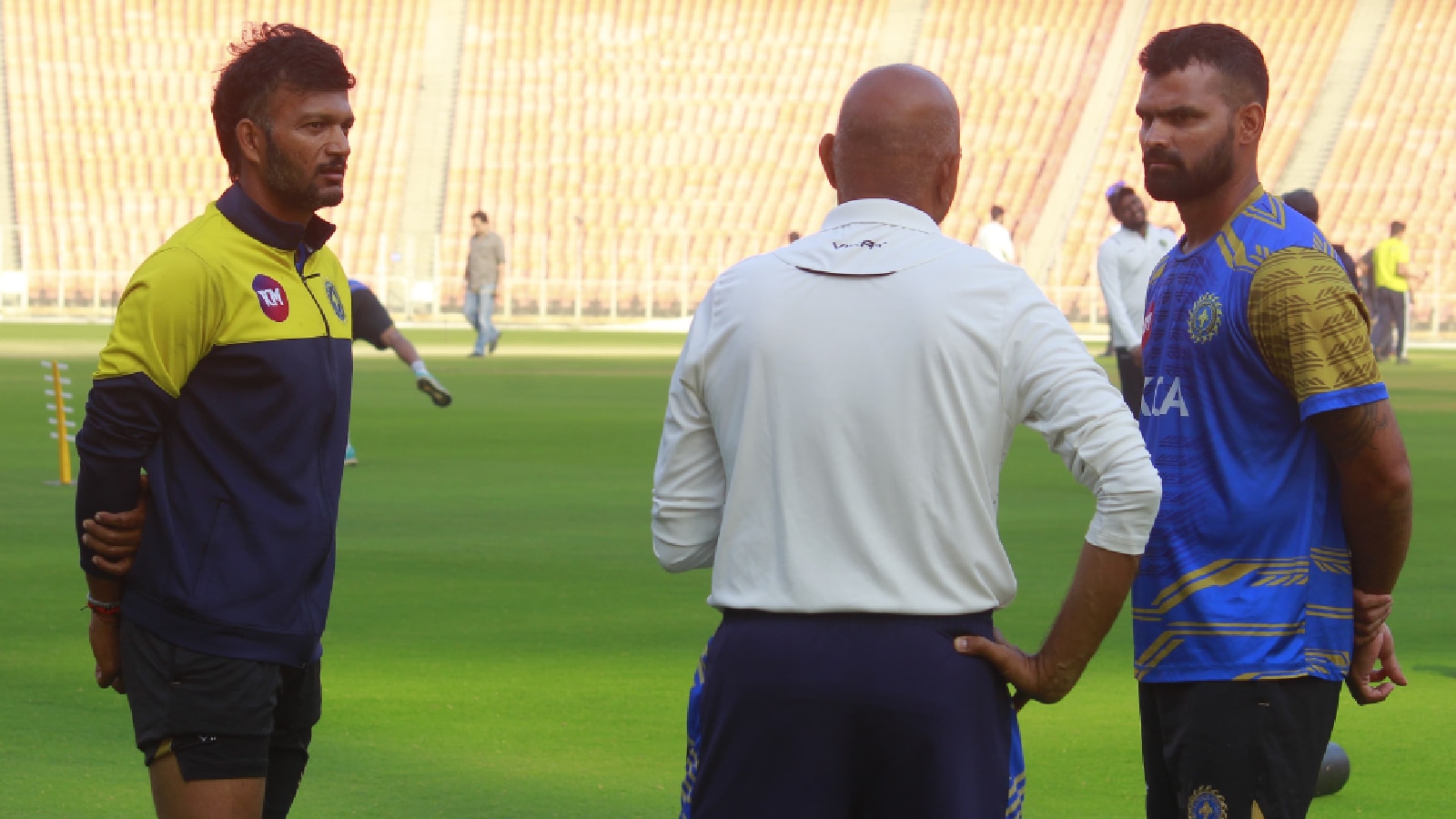 Kerala's Jalaj Saxena and Aditya Sarvate speak with head coach Amay Khurasiya after inspiring Kerala to victory over Gujarat in Ahmedabad. (Express Photo by Lalith Kalidas)