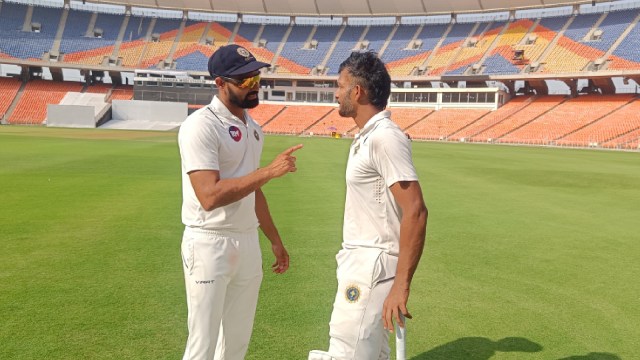 Kerala's Jalaj Saxena and Aditya Sarvate after inspiring Kerala to victory over Gujarat in Ahmedabad. (Express Photo by Lalith Kalidas)