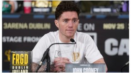 Boxer John Cooney listens during a news conference, Nov. 23, 2023, in Dublin. (Brian Lawless/PA via AP) Boxer John Cooney listens during a news conference, Nov. 23, 2023, in Dublin. (Brian Lawless/PA via AP)