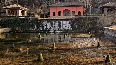 A view of a partially dried-up pond inside the Achabal Mughal Garden in Anantnag