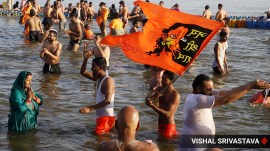 People take a holy dip at Triveni Sangam in Prayagraj during the ongoing Maha Kumbh Mela