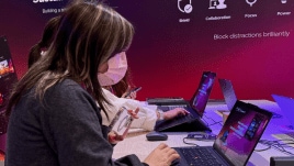 A visitor tries the new Lenovo Aura Editon laptop, which is the result of a collaboration with Intel at an event in Japan on Wednesday. ( Image credit: Anuj Bhatia/Indian Express)