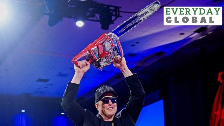 Elon Musk holds a chainsaw onstage at the Conservative Political Action Conference (CPAC) in National Harbor, Maryland, U.S., February 20, 2025. He said, “This is the chainsaw for bureaucracy.”