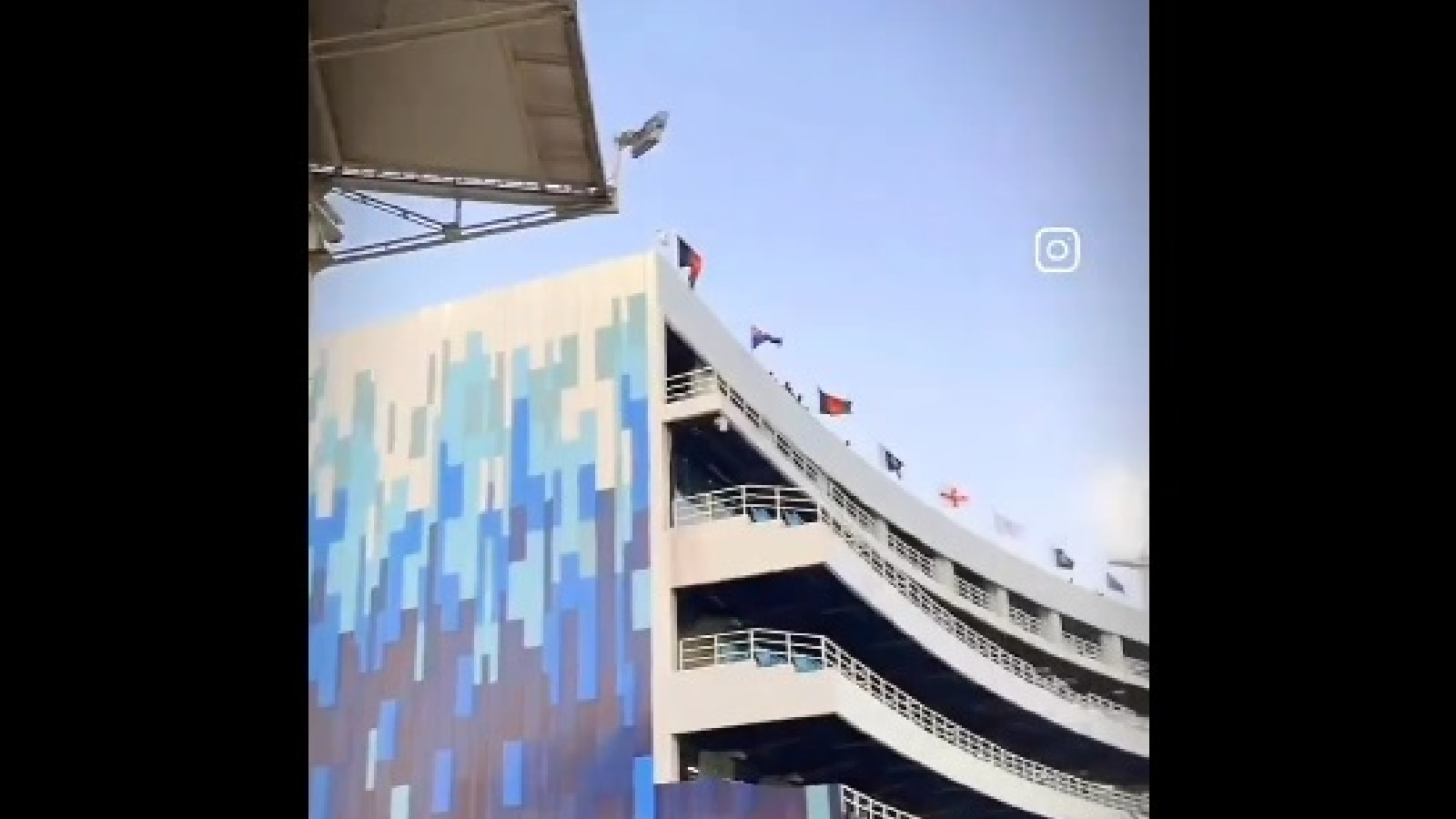 Screengrab from a clip on social media showing flags of the participating nations at the ICC Champions Trophy on the National Stadium in Karachi. (Screenshot: X)