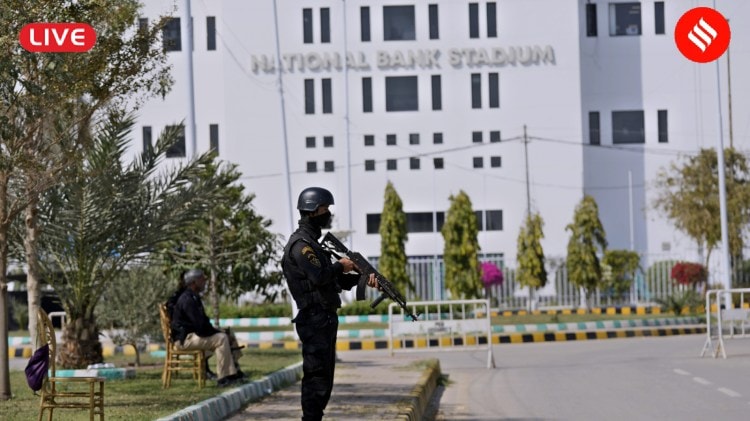 ICC Champions Trophy 2025 LIVE: Police officers stand guard outside the National Bank Stadium, where final preparations are going on for upcoming ICC Champions Trophy 2025, in Karachi. (AP Photo)