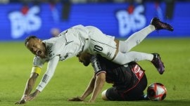 Neymar is fouled by Botafogo-SP's Alisson Cassiano during his debut match for Santos FC, in a Sao Paulo league soccer match, in Santos, Brazil, Wednesday, Feb. 5, 2025. (AP Photo)