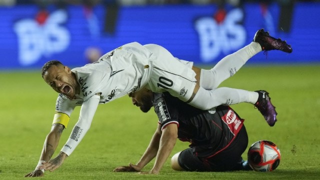 Neymar is fouled by Botafogo-SP's Alisson Cassiano during his debut lucifer  for Santos FC, successful  a Sao Paulo league   shot    match, successful  Santos, Brazil, Wednesday, Feb. 5, 2025. (AP Photo)