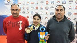 Suruchi Phogat with her father Inder Singh Phogat (L) and coach Suresh Singh. (Nihal Koshie/Express Photo)