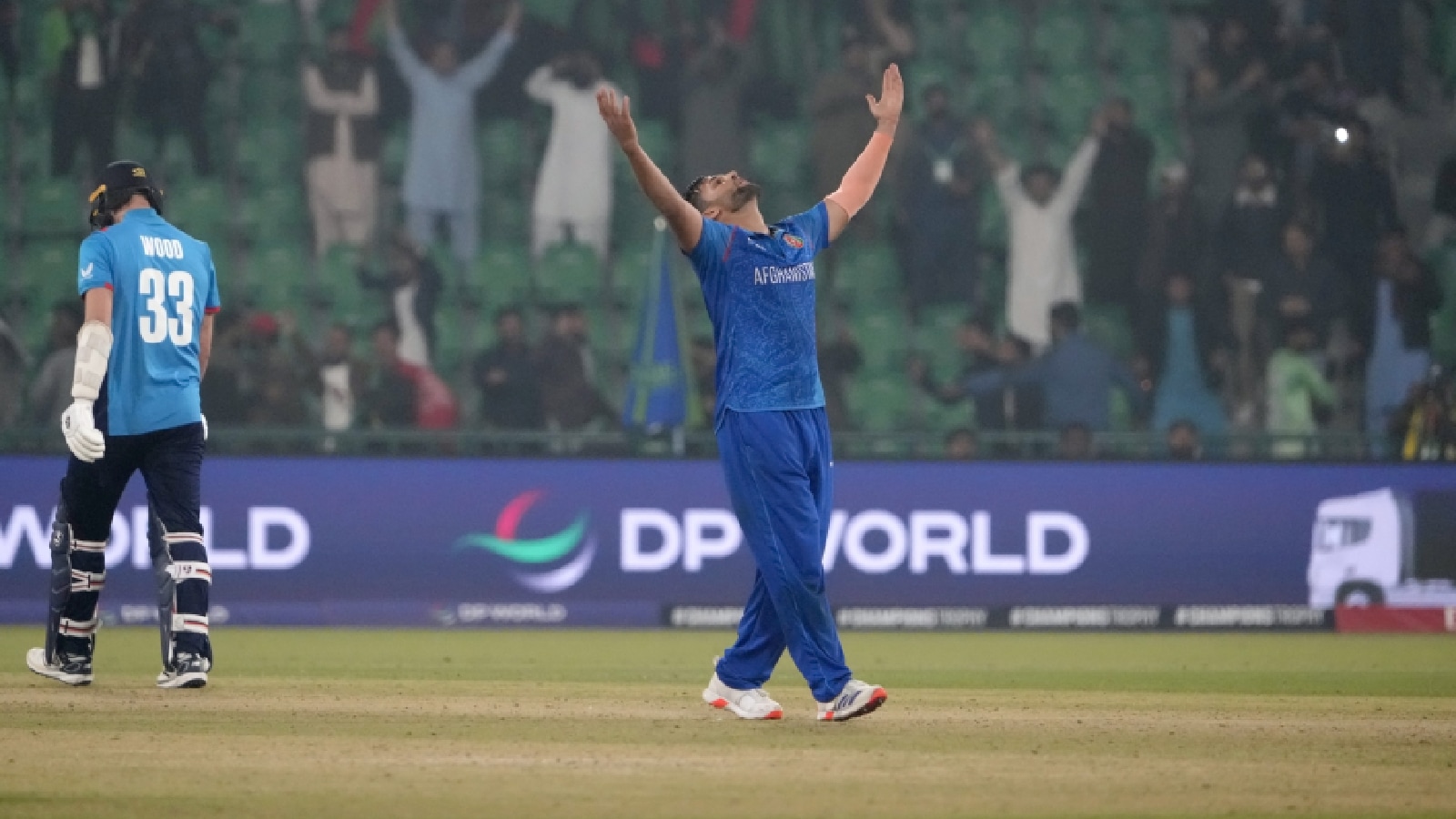 Afghanistan's Azmatullah Omarzai, center, celebrates after winning the ICC Champions Trophy cricket match against England, in Lahore, Pakistan, Wednesday, Feb. 26, 2025. (AP Photo)