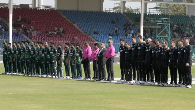 PAK vs NZ: Players of Pakistan, left, and New Zealand stand silent for their countries national anthem before start of the tri-series ODI cricket final match between Pakistan and New Zealand, in Karachi, Pakistan, Friday, Feb. 14, 2025. (AP Photo)