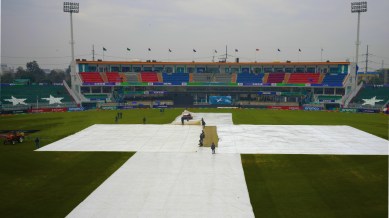 PAK vs BAN, Rawalpindi weather report: Groundsmen cover the pitch and field area due to low rain fall before start of the ICC Champions Trophy cricket match between Australia and South Africa, in Rawalpindi, Pakistan Tuesday, Feb. 25, 2025. (AP Photo)
