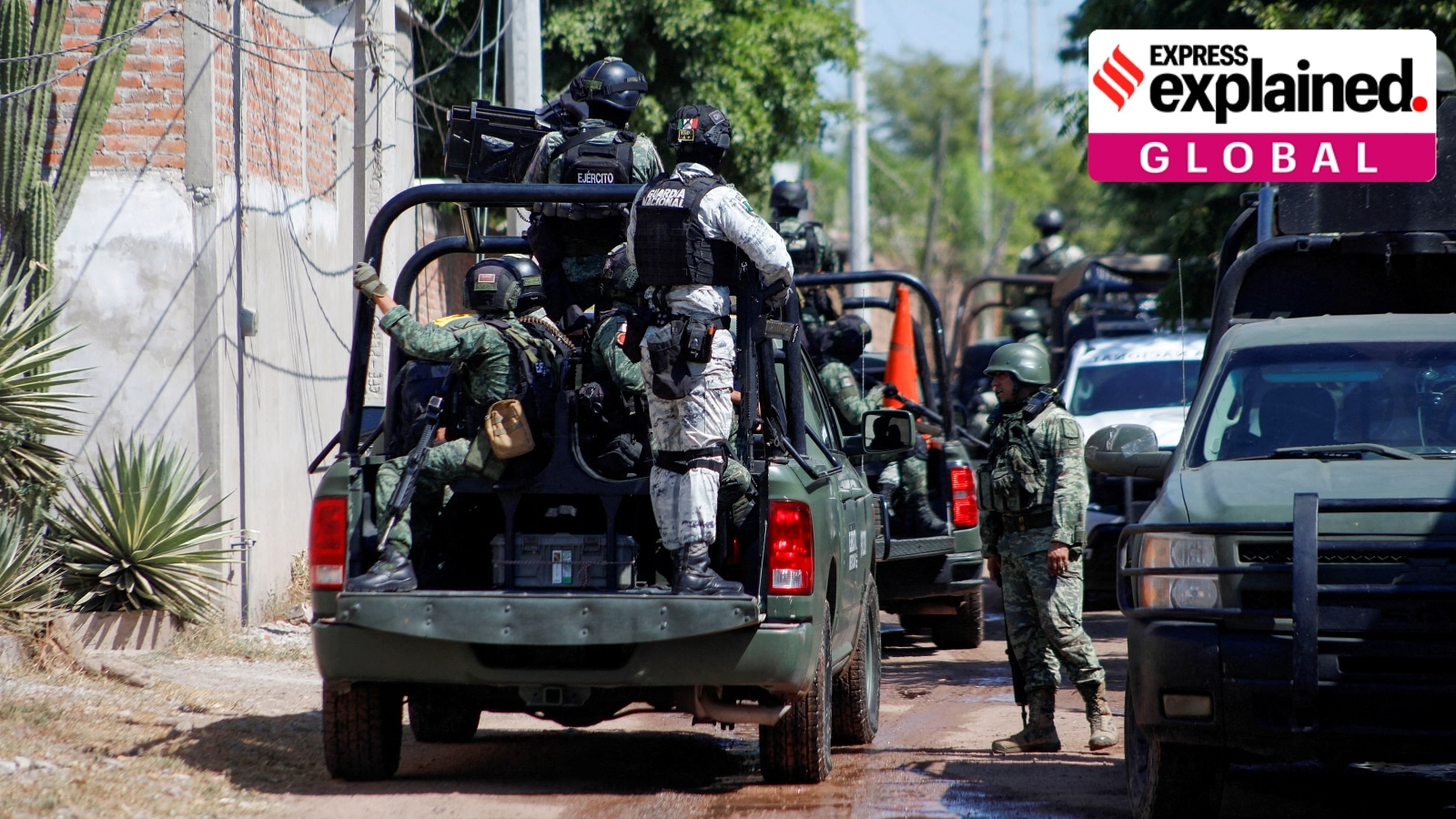 FILE PHOTO: Federal forces guard the perimeter of a scene following a shootout, in Culiacan