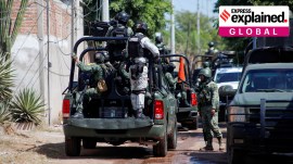 FILE PHOTO: Federal forces guard the perimeter of a scene following a shootout, in Culiacan