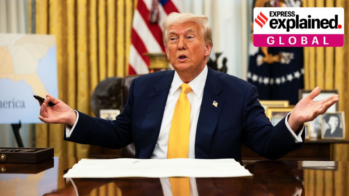 President Donald Trump signs the commission for Commerce Secretary Howard Lutnick during a swearing-in ceremony in the Oval Office of the White House in Washington, on February 21, 2025. (Tierney L. Cross/The New York Times)