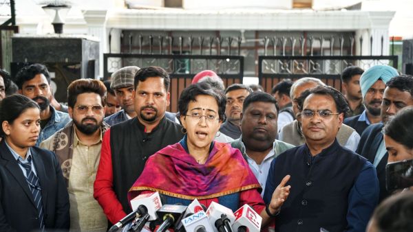 AAP leader Atishi, with the winning MLAs, outside the residence of AAP convenor Arvind Kejriwal on Sunday (Express Photo/Abhinav Saha)