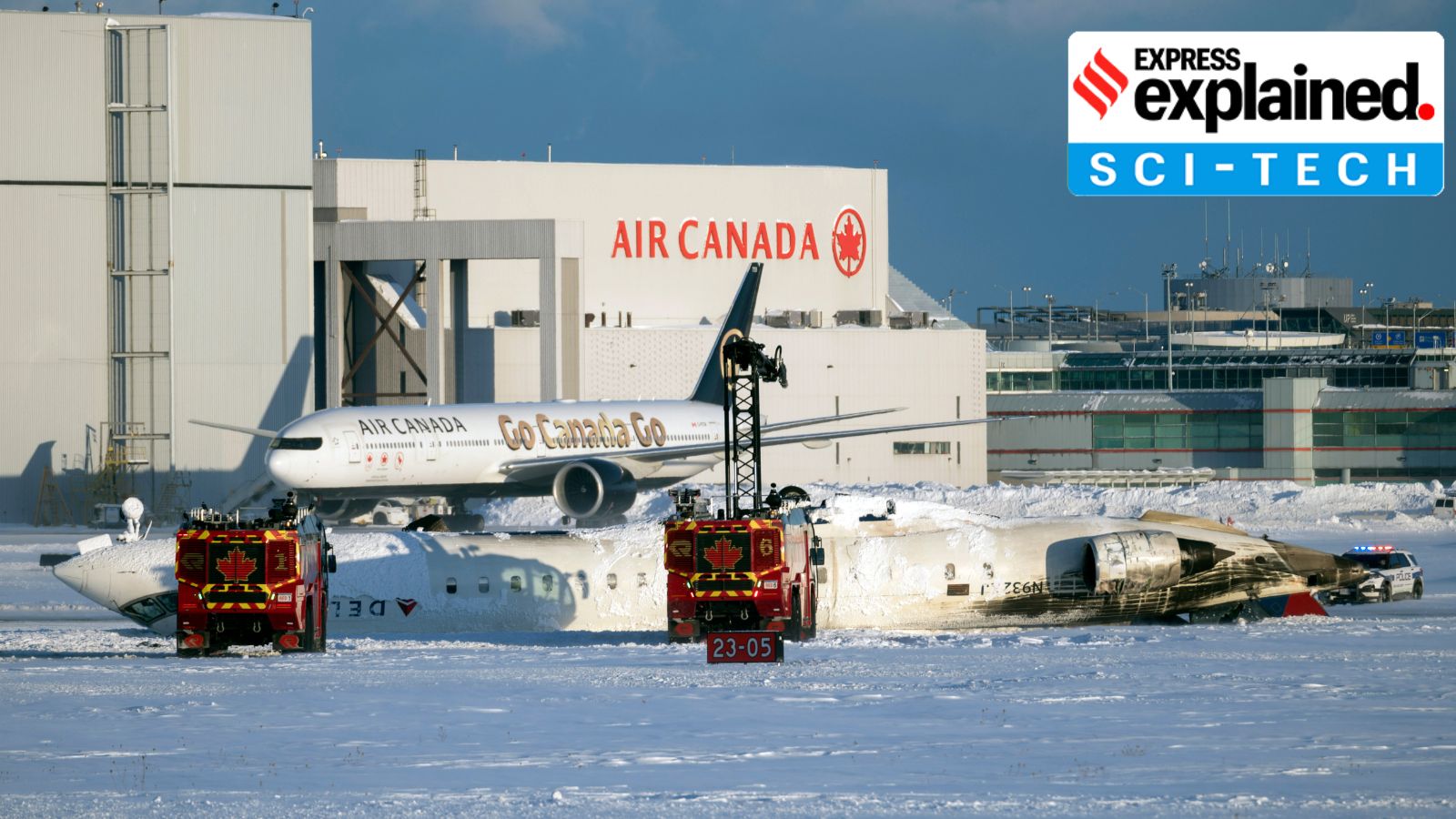 The wreckage of a Delta Air Lines passenger jet lies upside down on the tarmac after a crash landing at Toronto Pearson International Airport in Toronto on Monday, Feb. 17, 2025. Authorities are investigating the cause of the accident, which occurred amid strong winds and drifting snow. (Ian Willms/The New York Times)