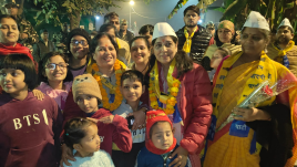 Sunita Kejriwal meets residents during a campaign in the New Delhi constituency. Her husband, AAP chief Arvind Kejriwal, is eyeing a fourth term from the seat.