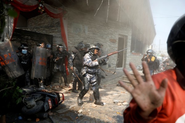 Riot police personnel in action during a protest by pro-monarchist demonstrators demanding the restoration of Nepal's monarchy, which was abolished in 2008, saying the governments have failed to make any significant changes, in Kathmandu, Nepal, March 28, 2025. REUTERS/Navesh Chitrakar