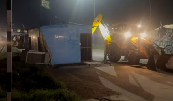 A JCB Machine destroys the tent houses of Farmers at Shambhu Border in Patiala on Wednesday. Express photos by Harmeet Sodhi.