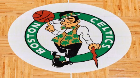 The Boston Celtics logo is seen at center court on the parquet floor before an NBA basketball game between the Boston Celtics and the Atlanta Hawks Sunday, Feb. 13, 2022, in Boston. (AP Photo)