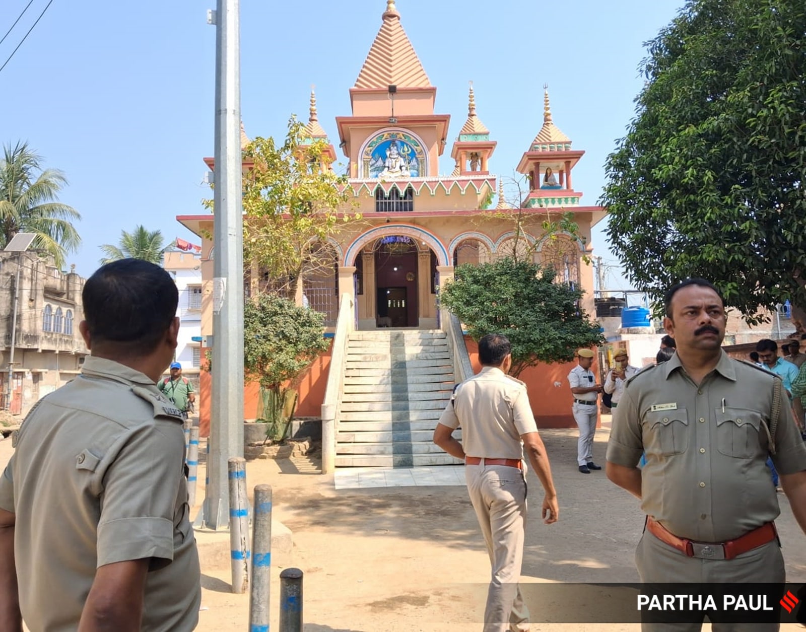 Heavy police protection outside the temple in West Bengal’s Purba Bardhaman district as members of a Dalit family offer prayers. (Express Photo: Partha Paul)