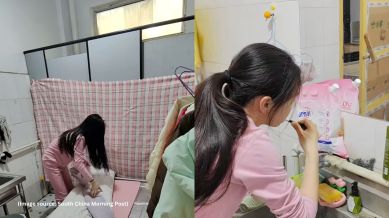 For privacy, the woman hangs a large cloth over the bathroom stall doors and sets up a folding bed each night (Image source: South China Morning Post)